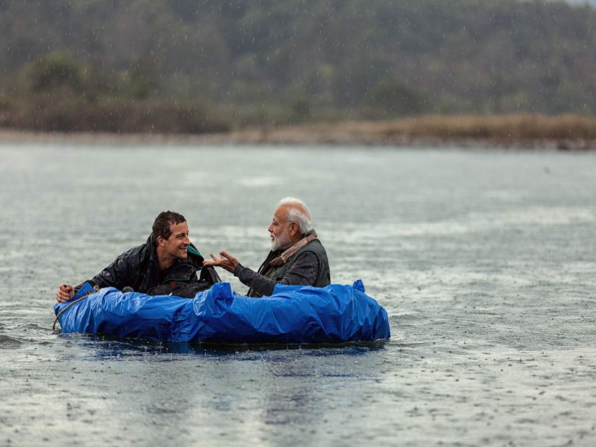 Bear Grylls with Modi, on a raft made of reeds. The 68-year-old PM is the oldest guest to feature on  the reality show which is about survival and adventure. (Photo credit: Courtesy: Discovery India)