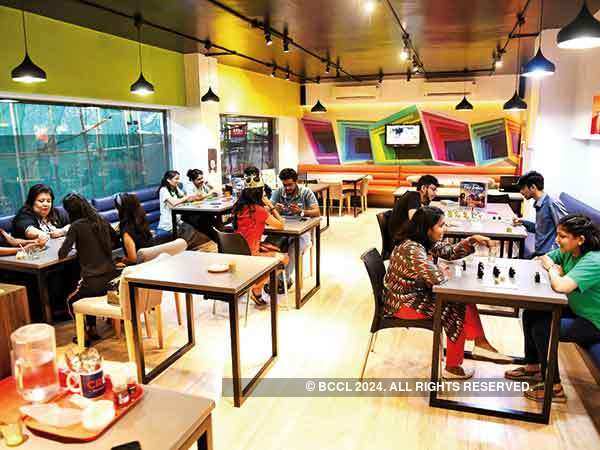 Mumbaikars during a board game session at a cafe in Fort