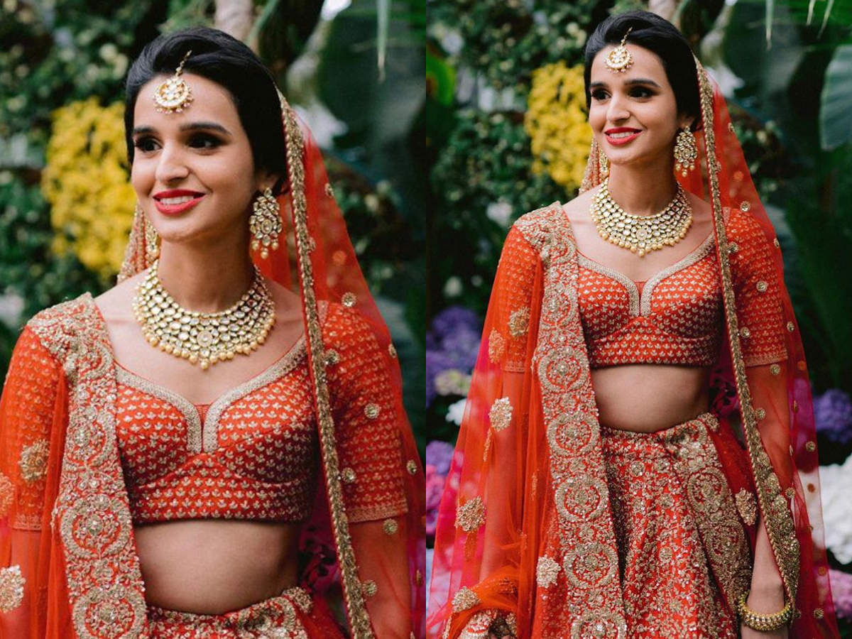 red and skin bridal lehenga