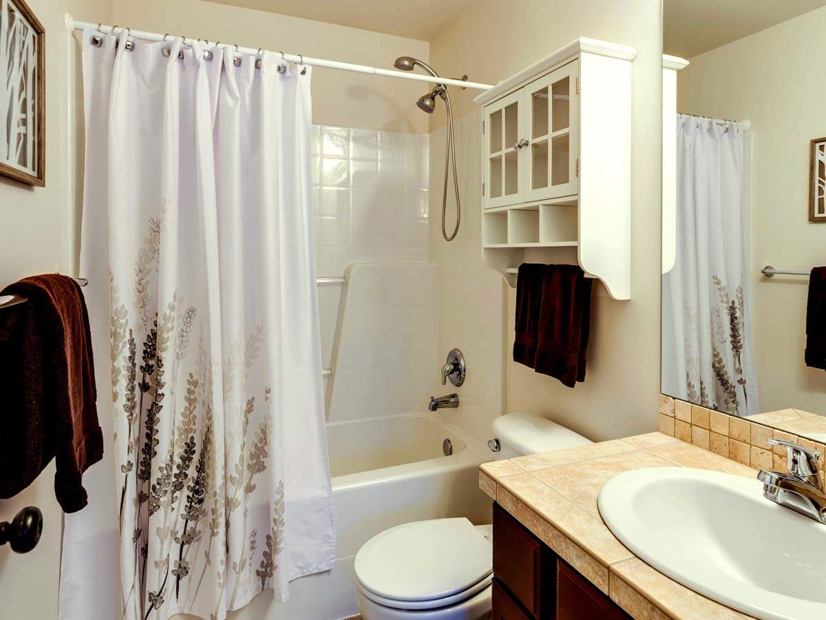 bathtub with shower curtain