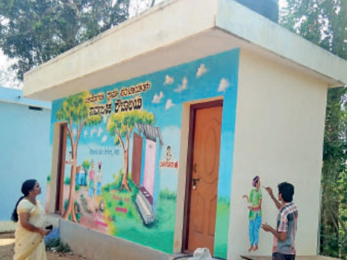 A public toilet in Dakshina Kannada being painted as part of a beautification contest