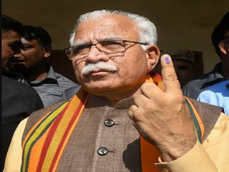  Haryana CM Manohar Lal Khattar shows his finger marked with indelible ink after casting vote. (PTI)