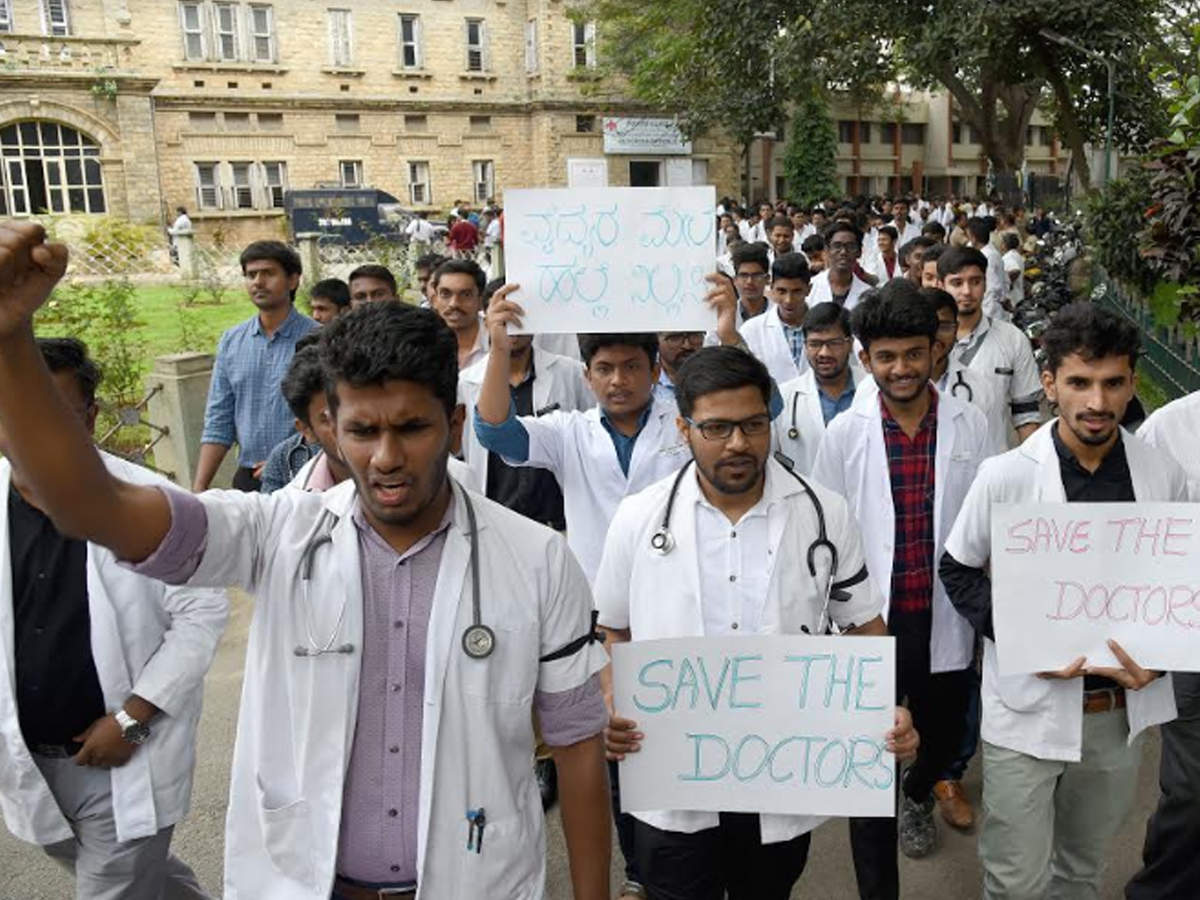 Hundreds of post graduate students and resident doctors of BMCRI stage a protest in front of the state run Minto Ophthalmic Hospital, in Bengaluru on Saturday.