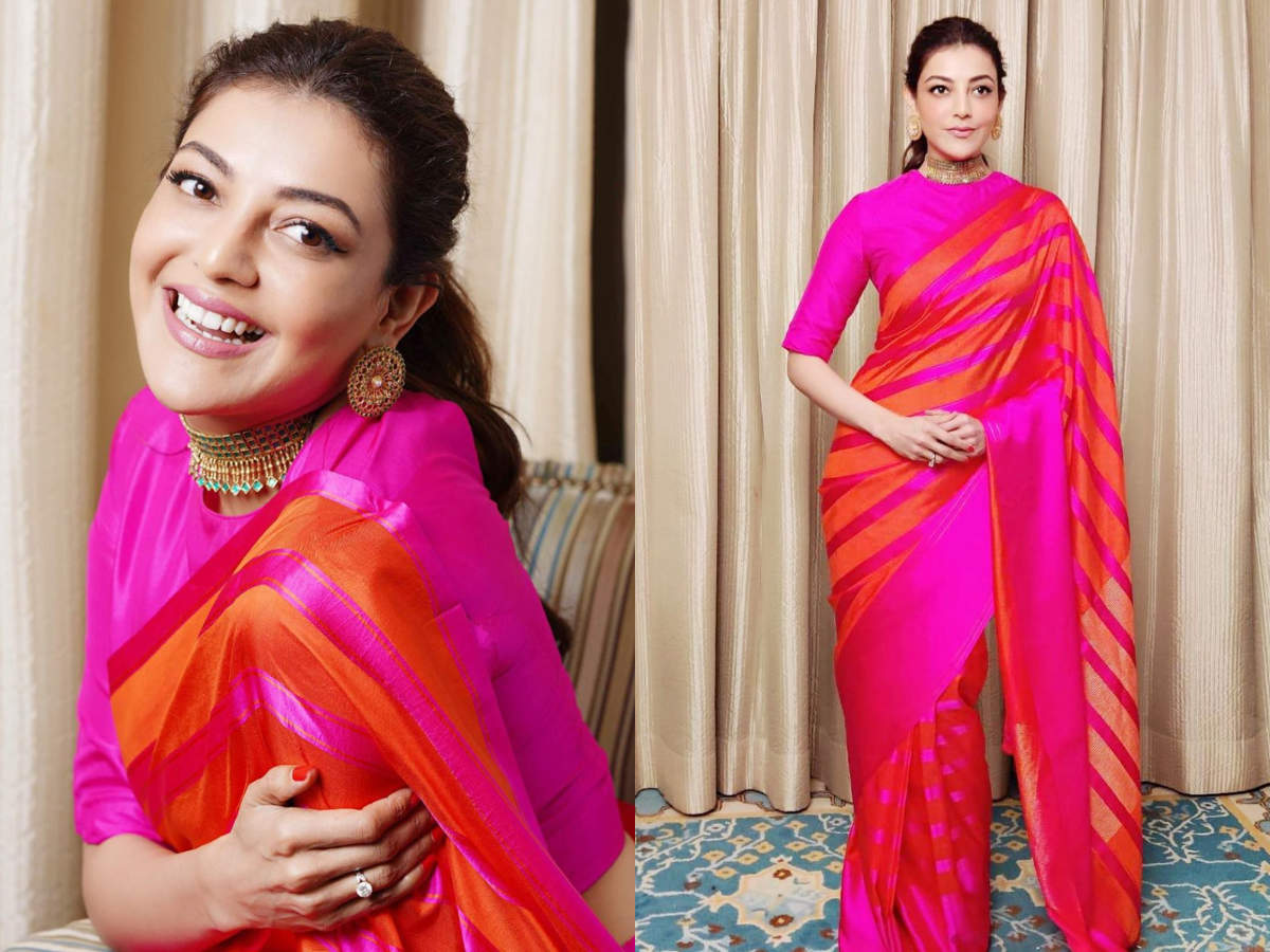 We are in love with Kajal Aggarwal's orange and pink striped sari ...