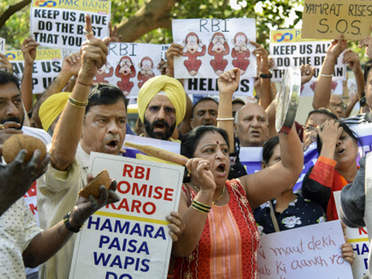 PMC Bank's depositors hold placards and raise slogans during a protest outside Reserve Bank of India at Bandra-Kurla Complex in Mumbai on Sunday. (Photo: PTI)