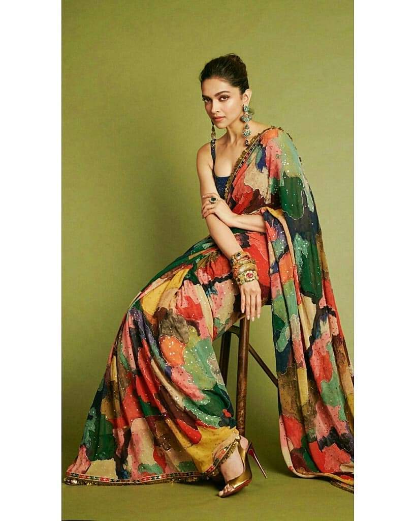 Latest Designer and Traditional Sarees: Deepika Padukone in Peacock Green  and Navy Blue Net saree