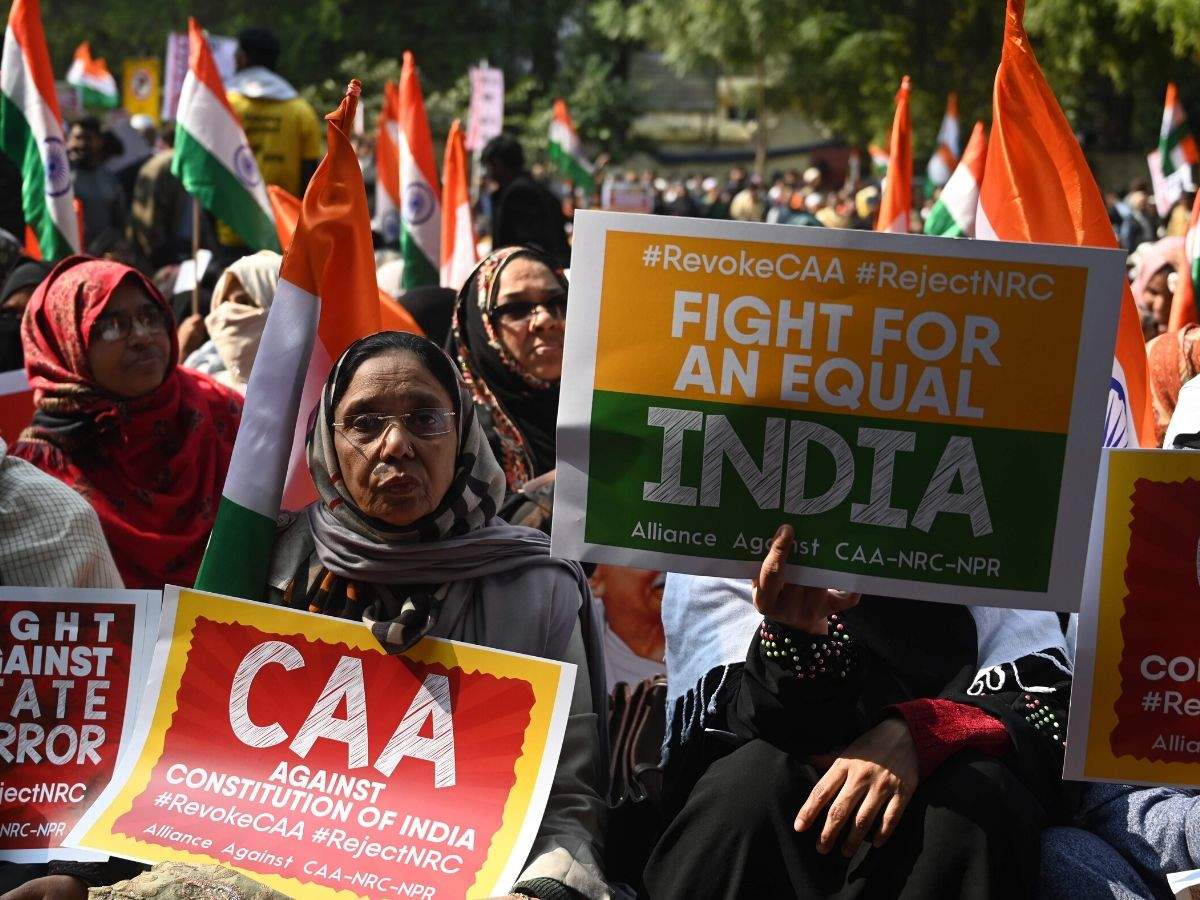 Protesters from Shaheen Bagh hold placards as they take part in a demonstration against the amended citizenship law at Jantar Mantar on January 29. (Photo: AFP)