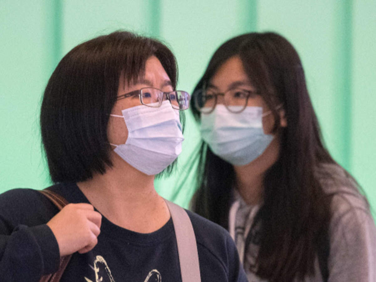 Passengers wear face mask to protect against coronavirus (AFP)