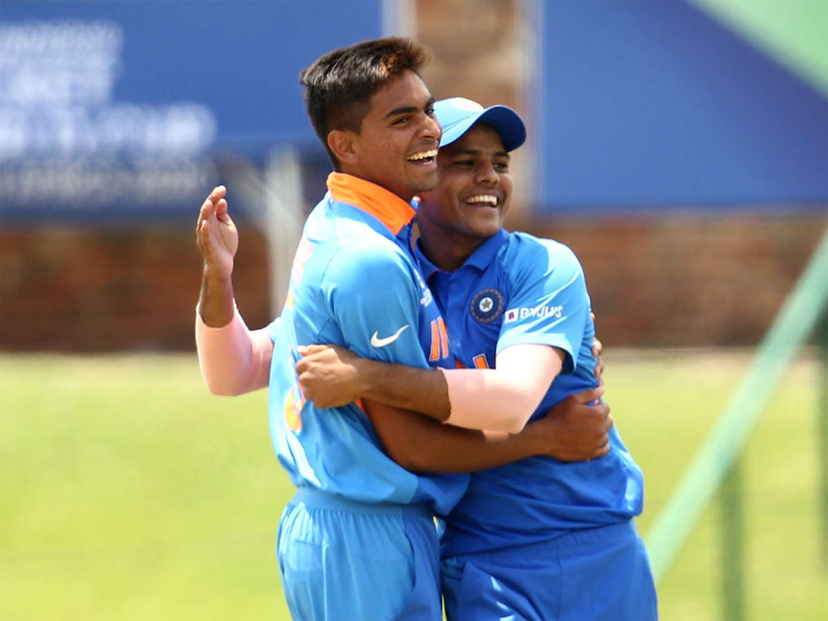 Kartik Tyagi, left, being congratulated by a team-mate after taking a wicket during India's semifinal against Pakistan in the ICC U-19 World Cup (Getty Images)