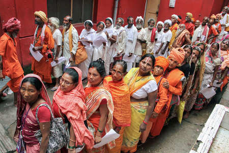 FILE — Pilgrims stand in queues to get themselves registered for Amarnath Yatra, at a base camp, in Jammu. (PTI photo)