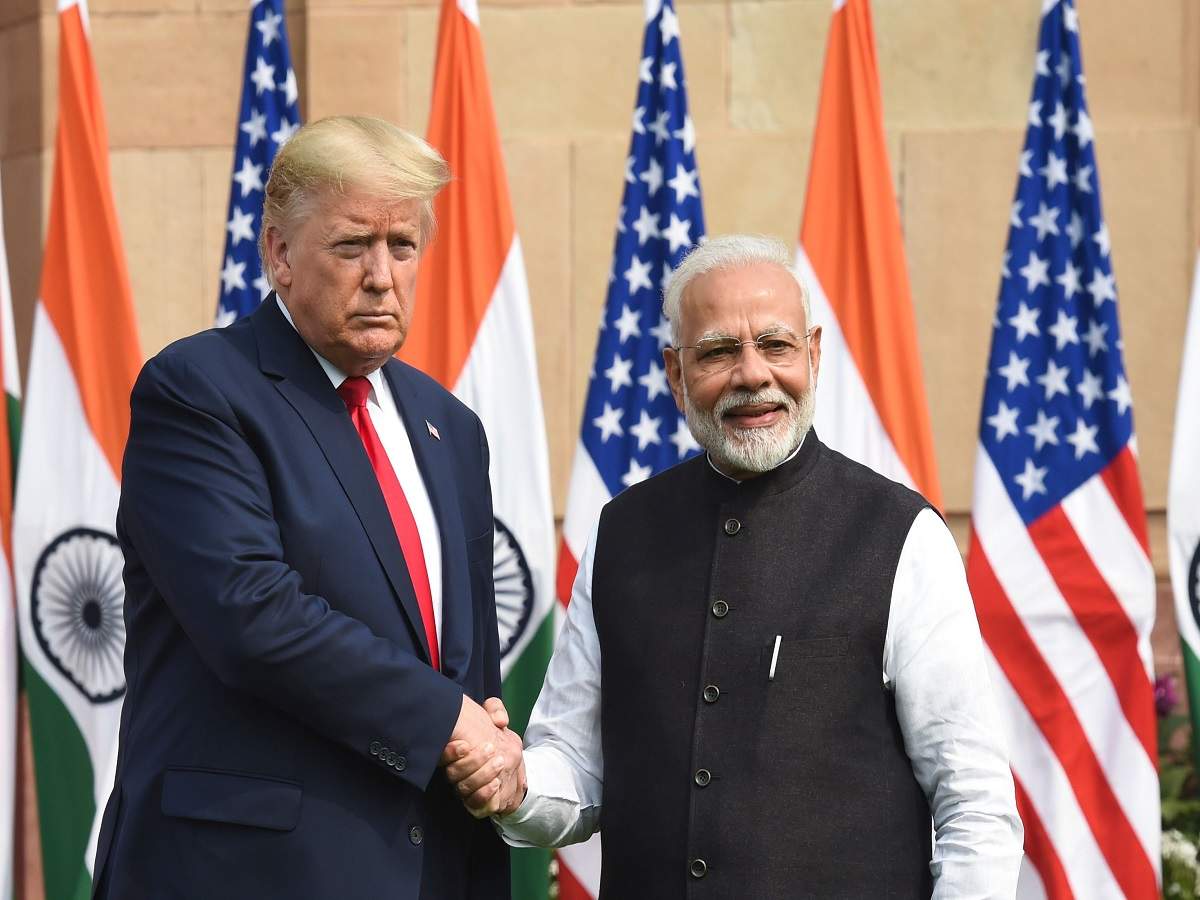 PM Modi (R) shakes hands with US President Donald Trump before a meeting at Hyderabad House in New Delhi. (AFP Photo)