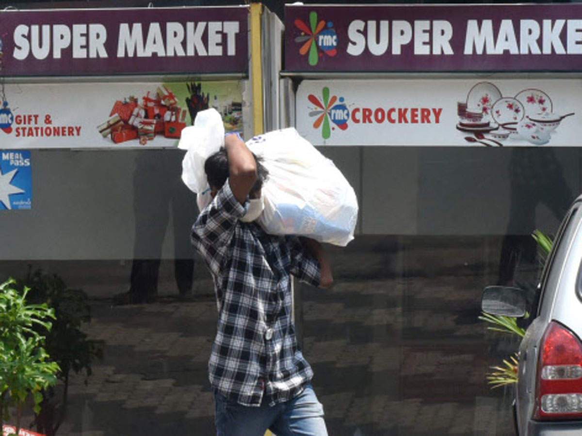 A man coming out from the super market after purchasing at Vazhuthacaud in Thiruvananthapuram on Monday. (TOI photo)