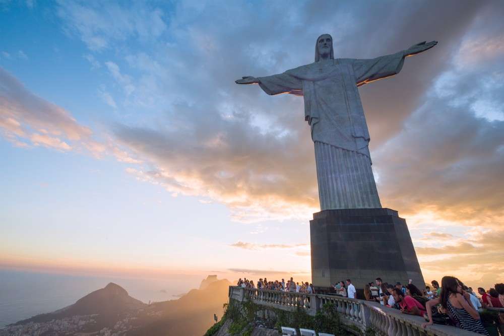 Statue of Christ the Redeemer in Brazil lit up with the flags of countries hit by COVID 19