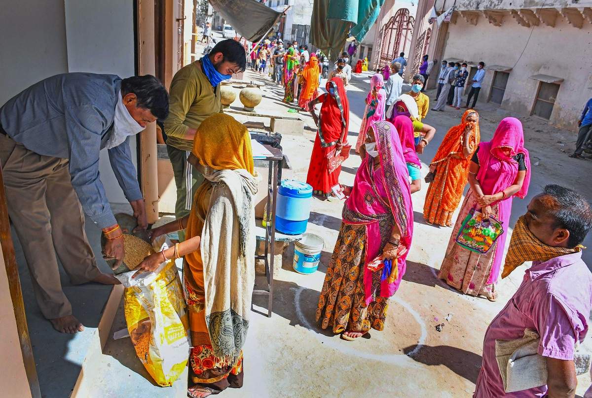 Women maintaing safe distance collect ration from a government depot during the coronavirus lockdown in Beawar (PTI photo)