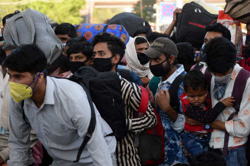The nationwide lockdown sparked a rush of migrant workers back to their native places (AFP)