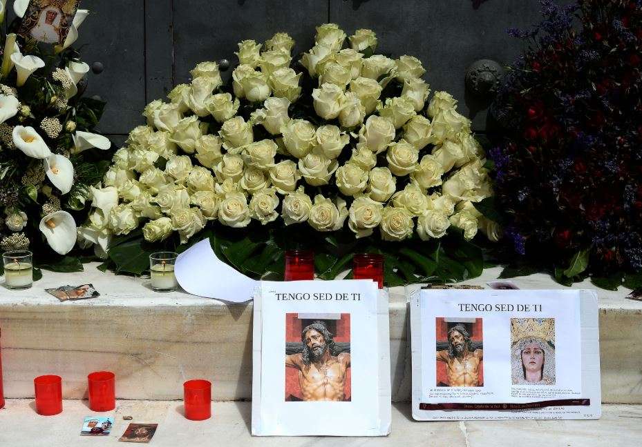 Flowers and other imagery left by the faithful adorn the entrance of the Santisimo Cristo de la Sed (Christ of Thirst) church in Seville