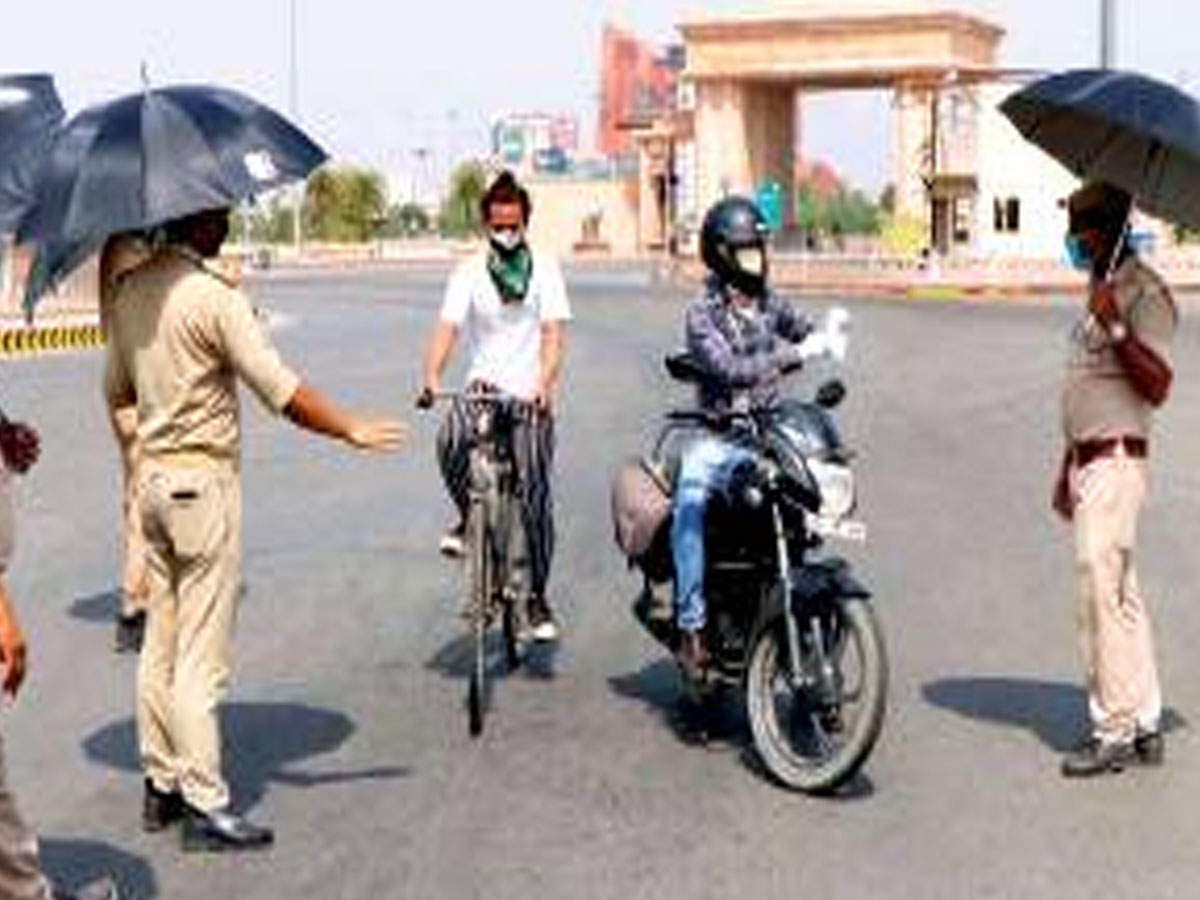 Policemen stopping locals amid lockdown in Lucknow on Tuesday