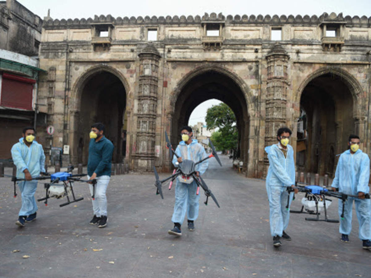Members of 'Team Drone Masters' carry their spraying disinfectants in Ahmedabad. (AFP)