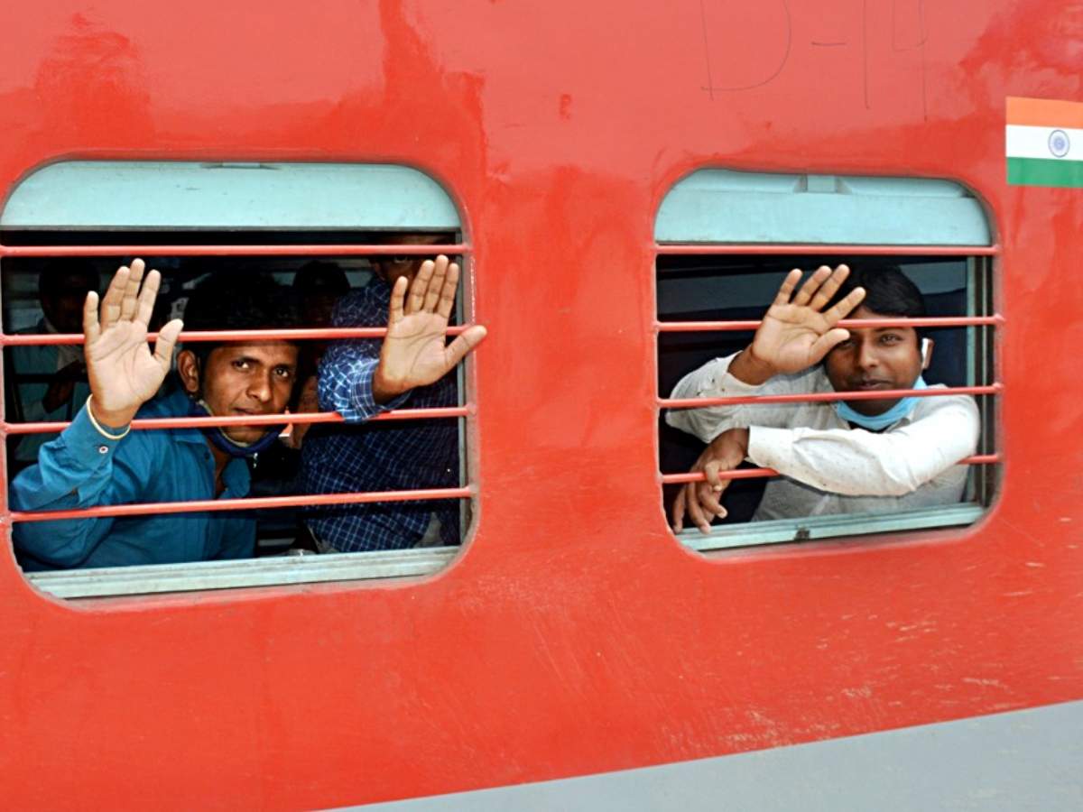 Migrant workers wave as they board a Shramik Special Train (ANI photo)