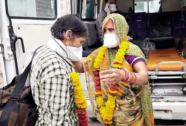 The couple exchange garlands, just as they did at their wedding four decades ago, in Damoh