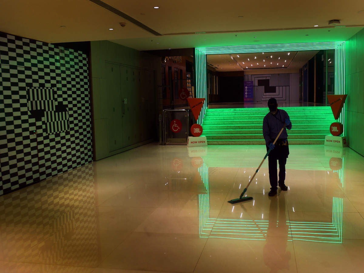 A worker sanitizes a mall in South Delhi.