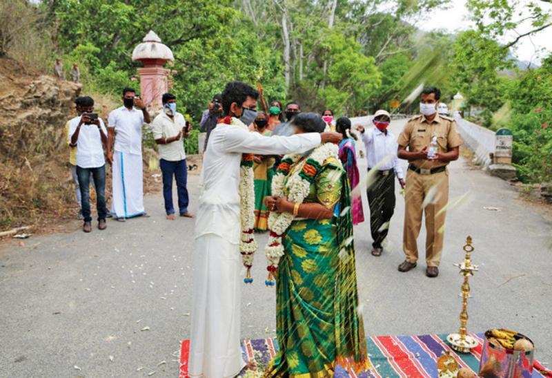 Tamil Nadu native Robinson and Kerala’s Priyanka get married on the Chinnar bridge at the border near  Munnar on Sunday. Forest and health officials blessed the ceremony