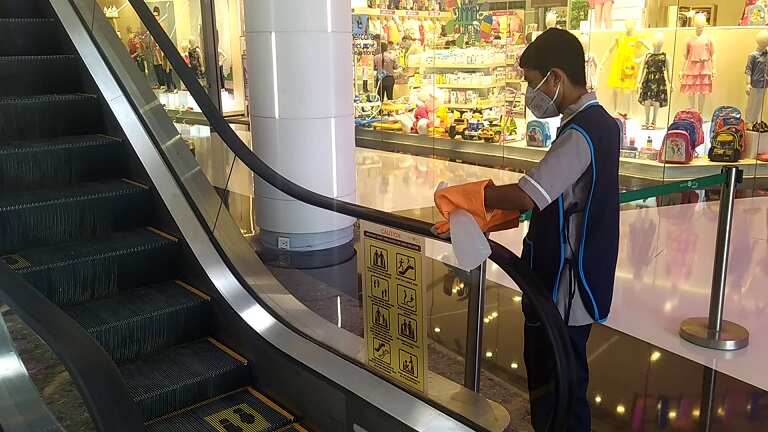 Escalator railings being sanitised1