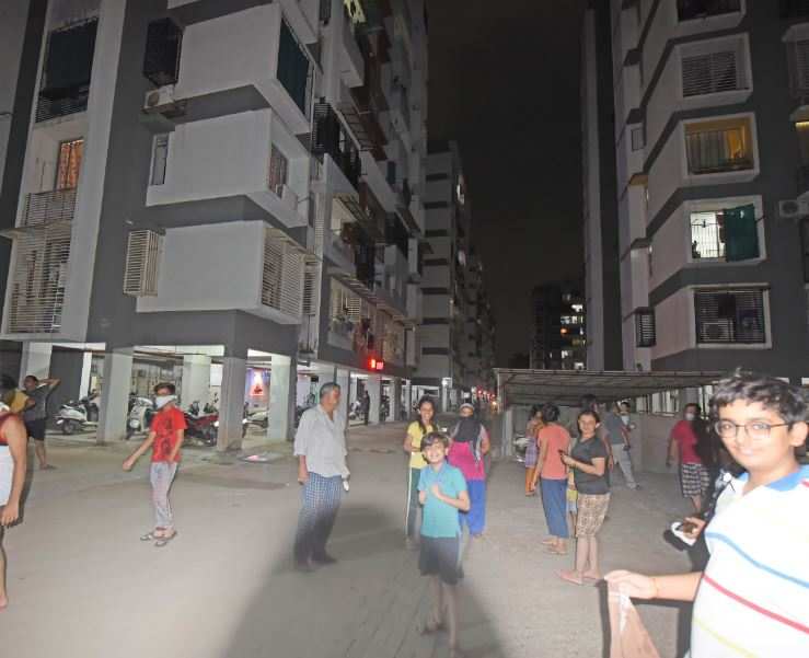 People came out from highrise buildings in Ahmedabad after tremors were felt on Sunday evening.