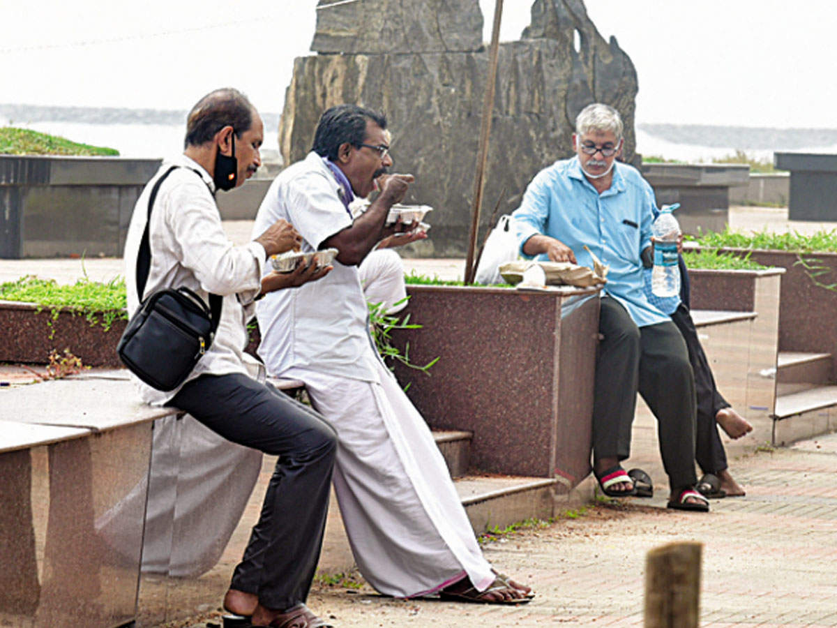 With most restaurants yet to resume dine-in services due to Covid-19 restrictions, citizens are left with no option but to have parcelled food. A scene from Kozhikode Beach on Tuesday