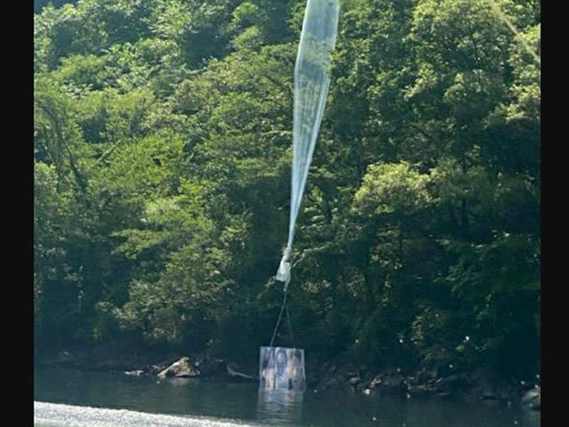 A balloon containing leaflets denouncing North Korean leader Kim Jong Un, released by a North Korean defector group on June 22, is seen at a hill in Hongcheon