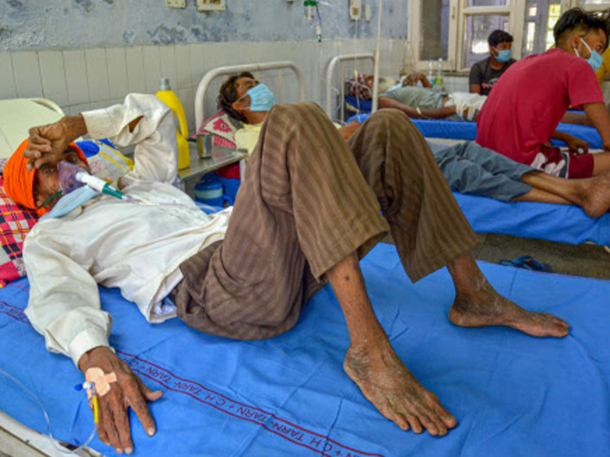 A man undergoes treatment after allegedly drinking spurious liquor at Civil Hospital in Tarn Taran district on Sunday. (PTI photo)