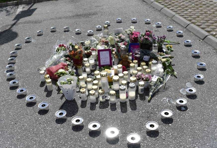  A makeshift memorial in form of a heart with candles and flowers is seen at the site where a twelve year old girl was shot near a petrol station in Botkyrka, south of Stockholm