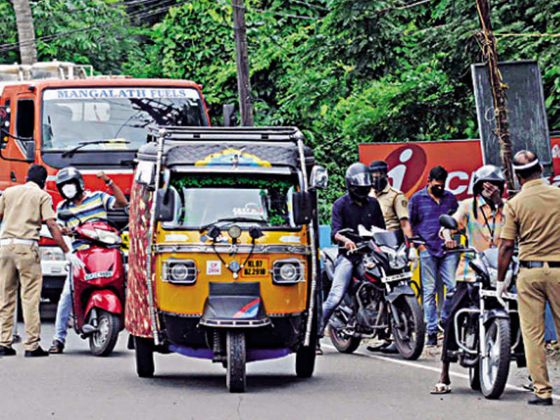 Police officers regulating traffic at Thoppumpadi, Kochi on Tuesday