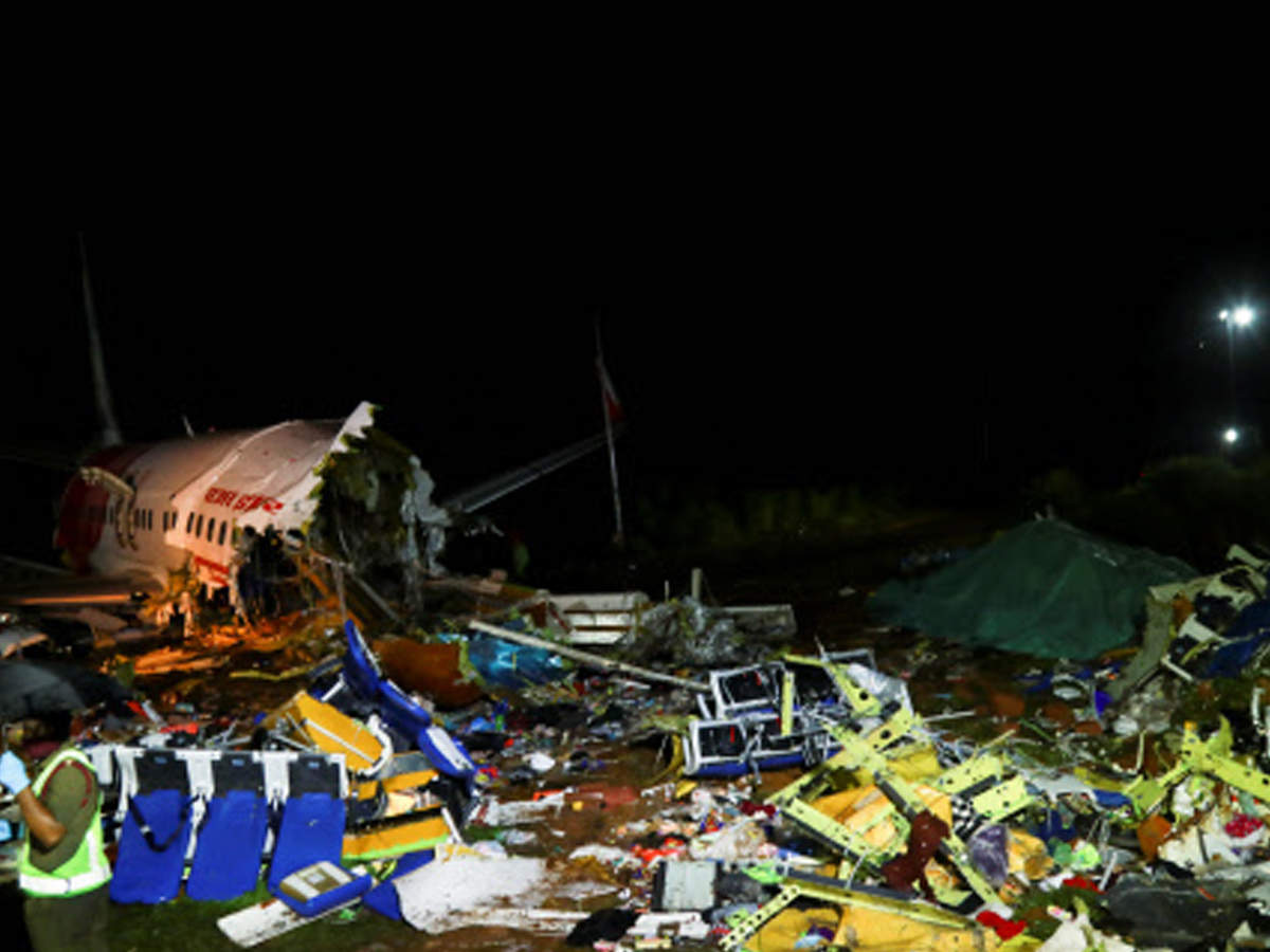 A security personnel stands guard in front of the wreckage from an Air India Express jet (AFP)