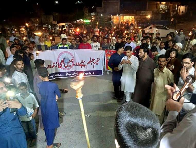 People take part in a torch rally during a protest to oppose the mega-dams to be constructed by Chinese companies on Neelum-Jhelum River in Muzaffarabad city of Pakistan occupied Kashmir (File photo)
