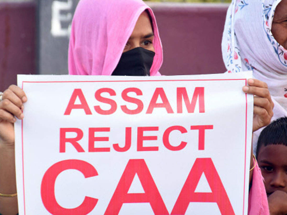 Activists of the Krishak Mukti Sangram Samiti (KMSS) hold a placard during a protest against Citizenship Amendment Act (CAA) and demanding the immediate release of the jailed KMSS leader Akhil Gogoi at Chanchal in Guwahati on Thursday. (ANI Photo)