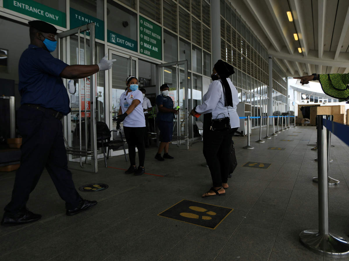 A passenger is been guided by officials at Nnamdi Azikiwe International Airport in Abuja, Nigeria. (Reuters)