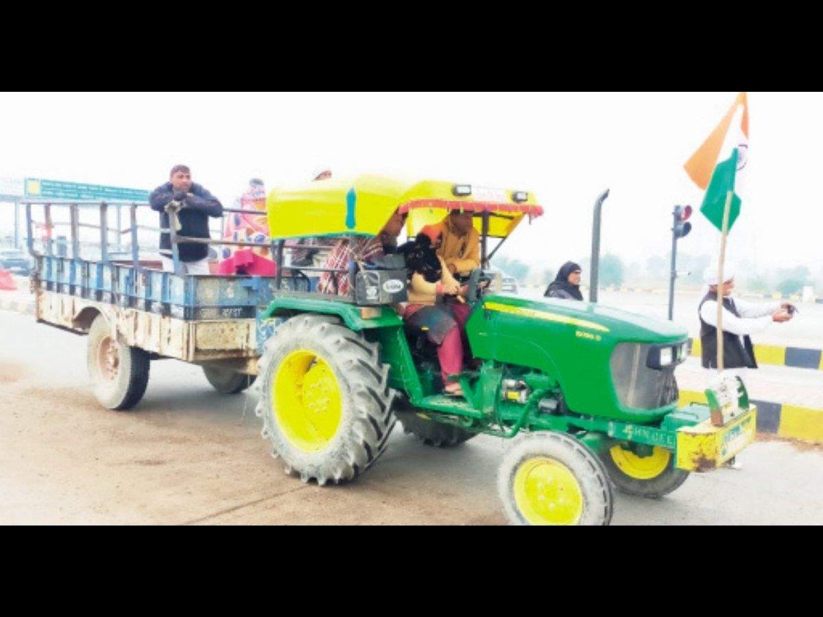 Women being trained to drive tractor near Khatkar toll plaza