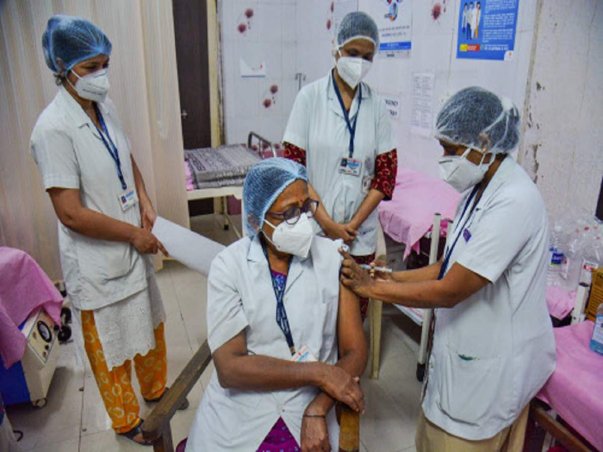 A medic vaccinates a healthworker with Covishield vaccine during a countrywide inoculation drive against Covid-19 at Thane Civil Hospital. (PTI photo)