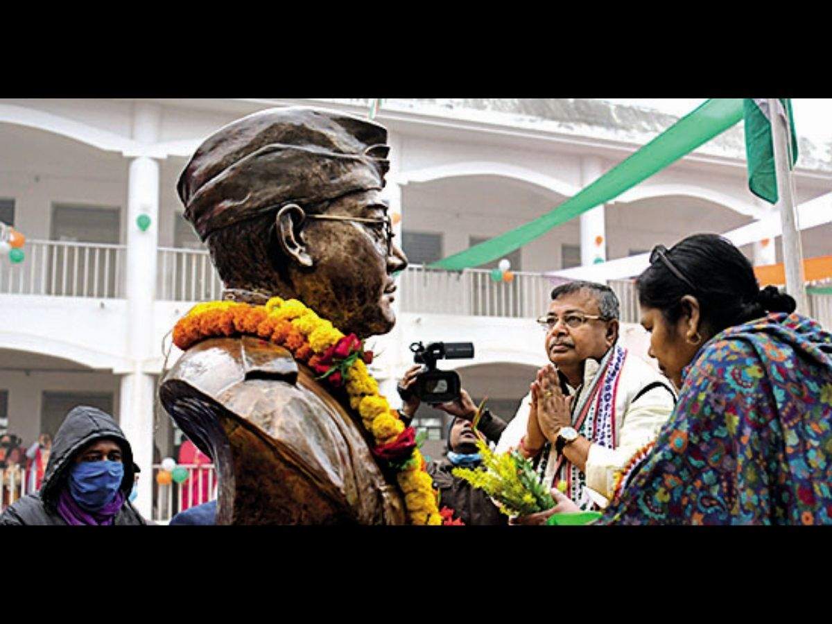 Tripura MP Pratima Bhowmik and education minister Ratan Lal Nath pay tributes to the statue of Netaji in Agartala