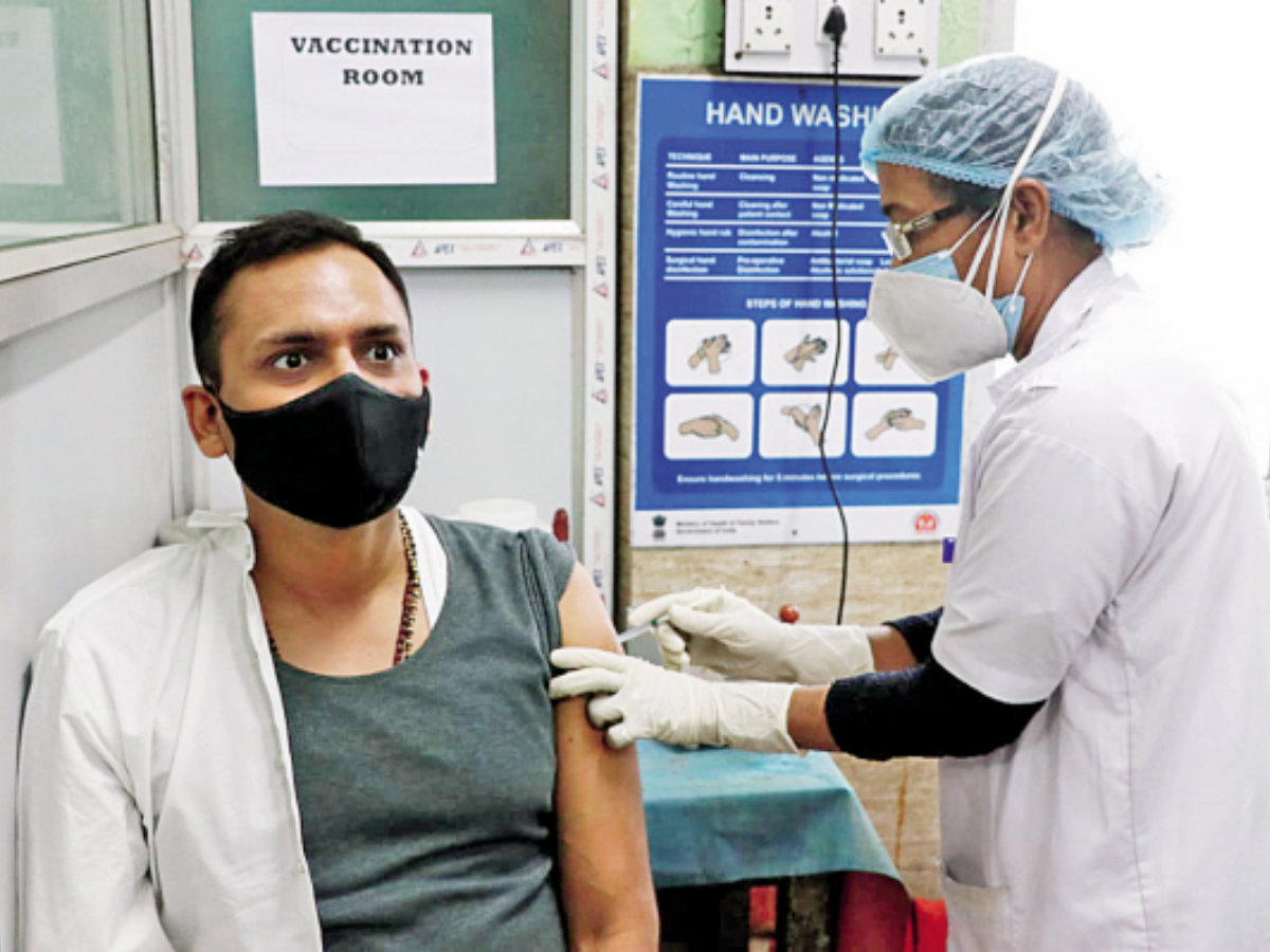 Howrah City Police commissioner Kunal Aggarwal gets the vaccine on Friday