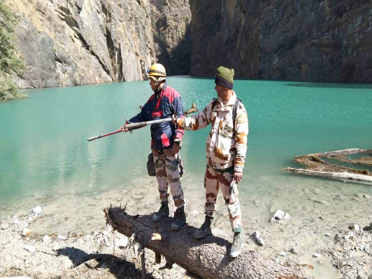 Indo-Tibetan Border Police (ITBP) team with DRDO officials reached Murenda where a lake is formed after recent floods. (ANI photo)