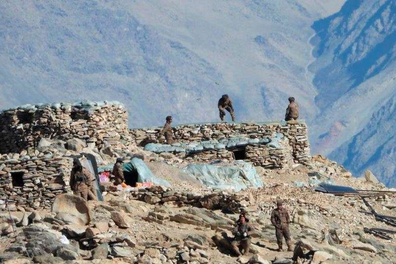 This photograph provided by the Indian Army, shows Chinese troops dismantling their bunkers at Pangong Tso region, in Ladakh along the India-China border (AP)