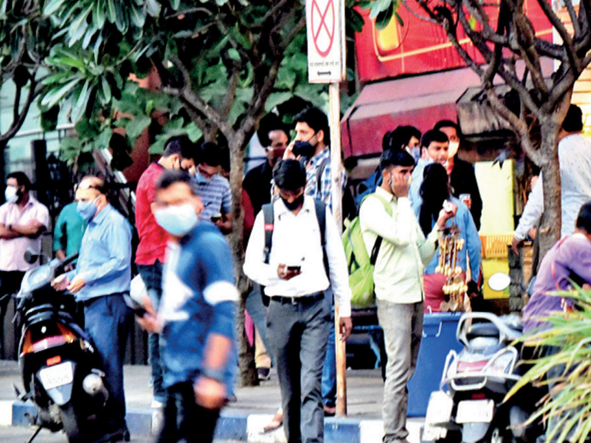 People wait outside a popular restaurant on Fergusson College Road on Monday
