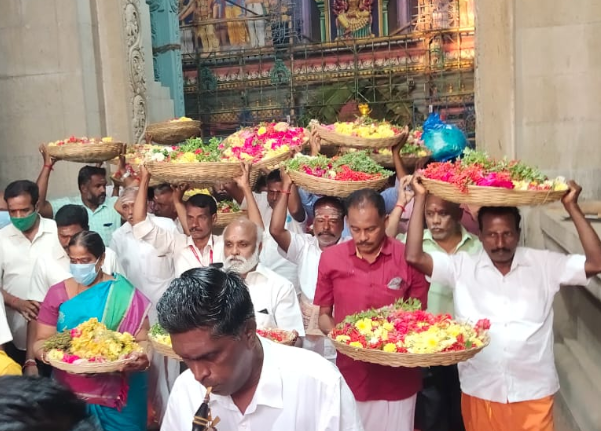 Temple management and senior priests carried the first batch of flowers to adorn the chief deity, Mariamman, in the sanctum sanctorum. 
