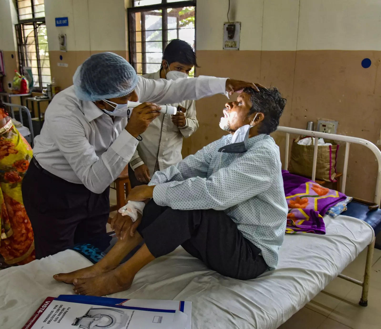 Hyderabad: A doctor treats a Black Fungus infected patient at Mucormycosis ward of government ENT hospital in Hyderabad. (PTI Photo)
