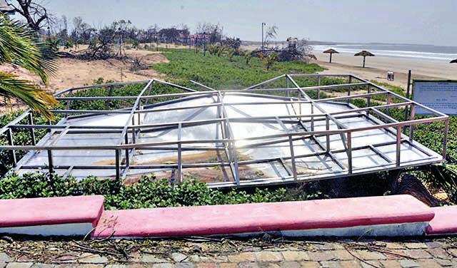 A fallen hoarding leading up to Ghoghla beach in Diu on Thursday