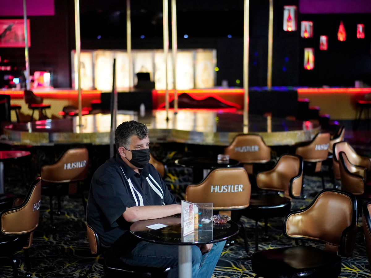 Jeff Cantrell waits at Larry Flint's Hustler Club strip club after getting his second dose of coronavirus vaccine. AP Photo