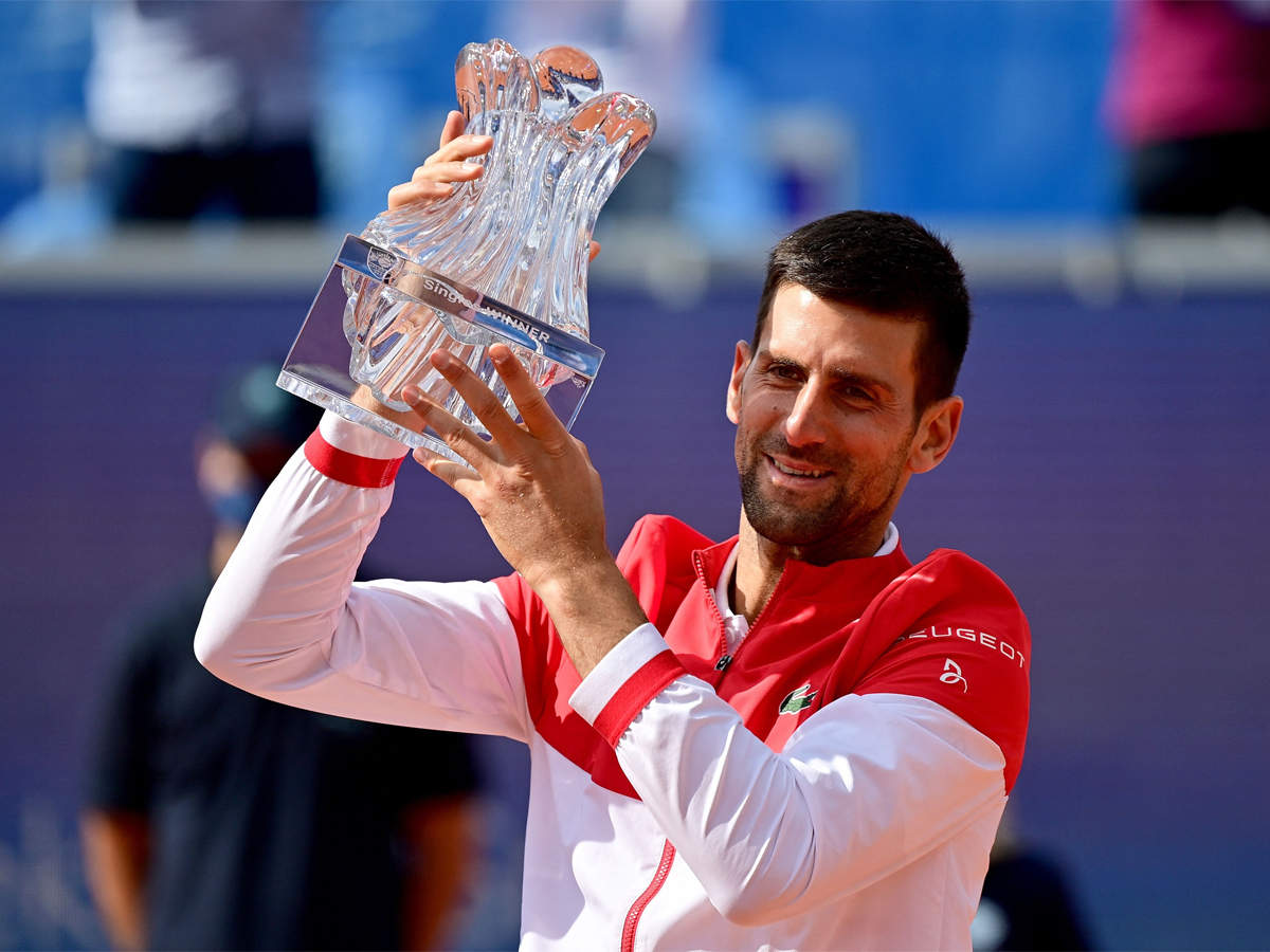 Novak Djokovic holds the winning trophy after his final against Alex Molcan at the Belgrade Open. (AFP Photo)