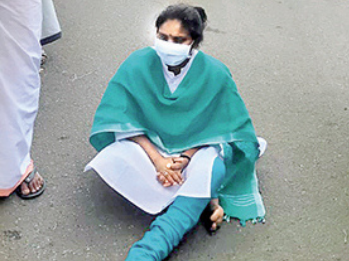 Alathur MP Ramya Haridas sits on a road near Alathur on Sunday after CPM local leaders allegedly threatened to kill her
